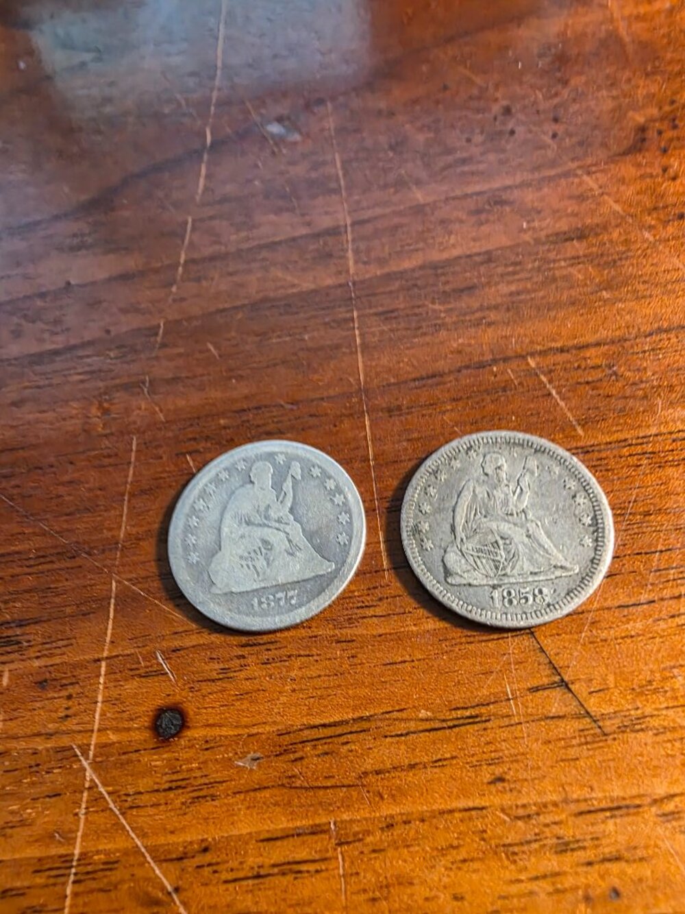 1-1858, 1-1877 SEATED QUARTERS AND 1-1903 S BARBAR HALF DOLLAR ALL SILVER
